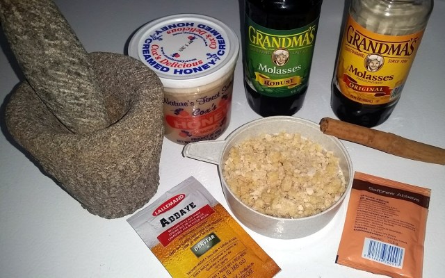 honey, molasses, cinnamon, ginger, and yeast, with mortar & pestle, for the winter warmer