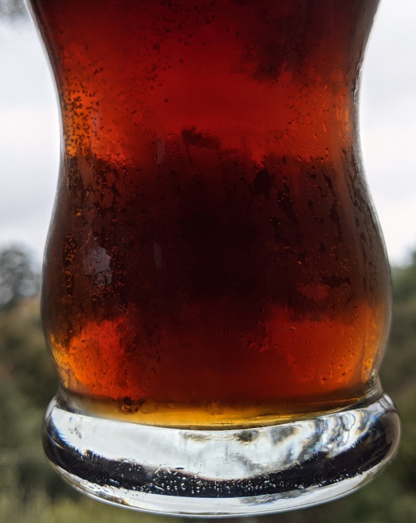 reddish-brown beer in glass